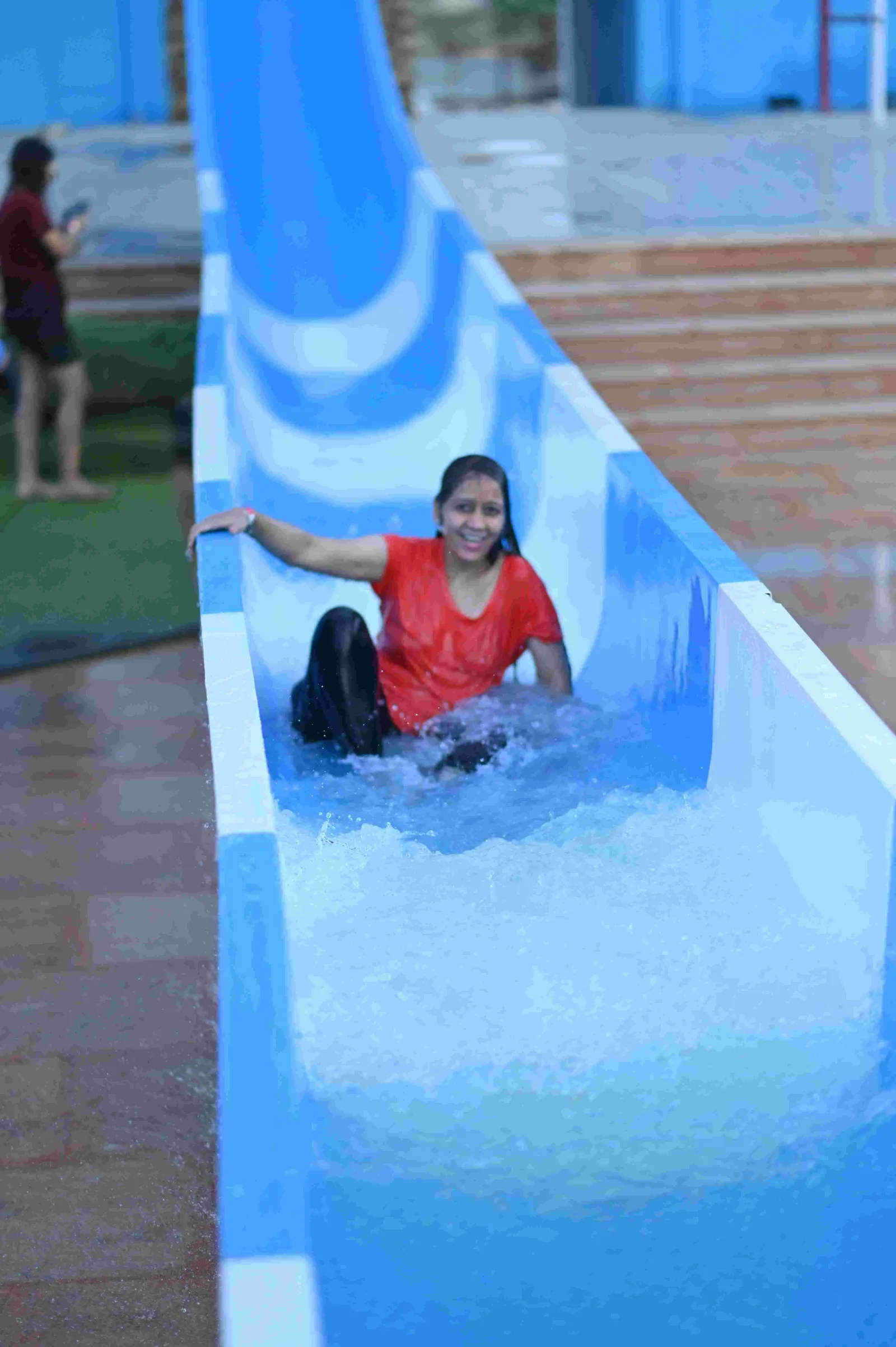 Guest splashing down the water slide at Shagun Resorts water park