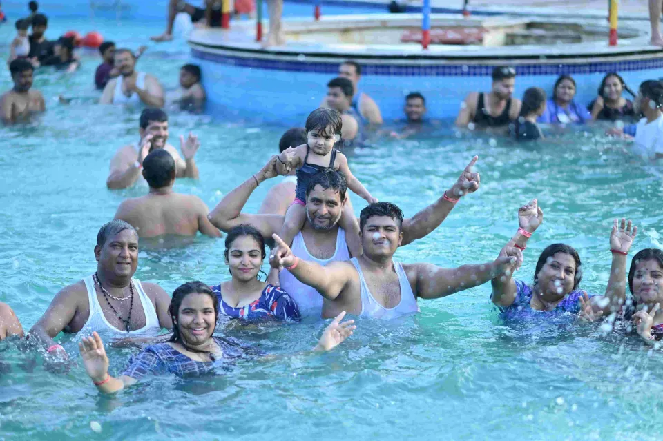 Big group of friends in the wave pool at Shagun Resorts