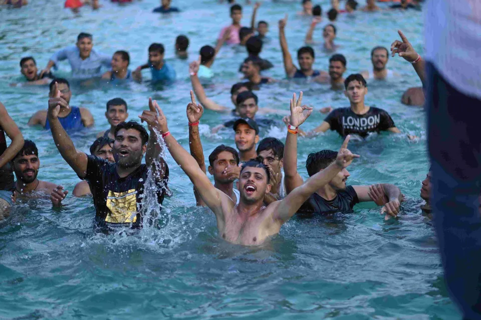 Crowd dancing in the pool at a Shagun Resorts pool party, Jodhpur