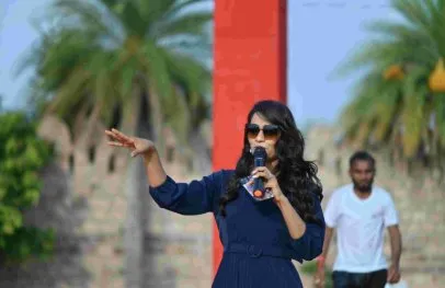 Host on stage at a celebration at Shagun Resorts